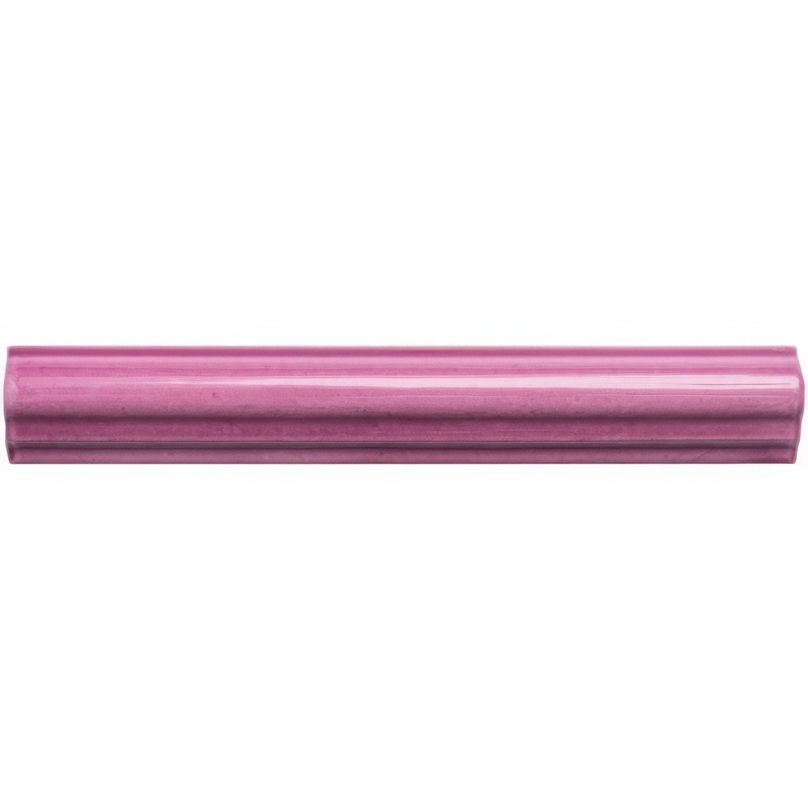 A sleek glossy pink ceramic Tayberry ogee moulding tile with subtle ribbed texture and rounded edges
