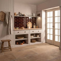 Teapot brown large brick displayed in a rustic kitchen with white cabinets, dark brown subway tile backsplash, and copper pots