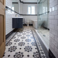 The tenby black dover white and grey bathroom tile features a geometric black and white patterned floor design
