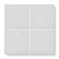 Four square light gray quartzite terrazzo angelo base tiles with subtle speckled texture for flooring and walls