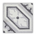 Gray and white terrazzo bertoli tile featuring a central floral motif framed by geometric borders