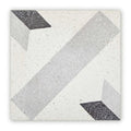 Terrazzo crovato geometric terrazzo tile with white base and gray black speckled angular stripes pattern