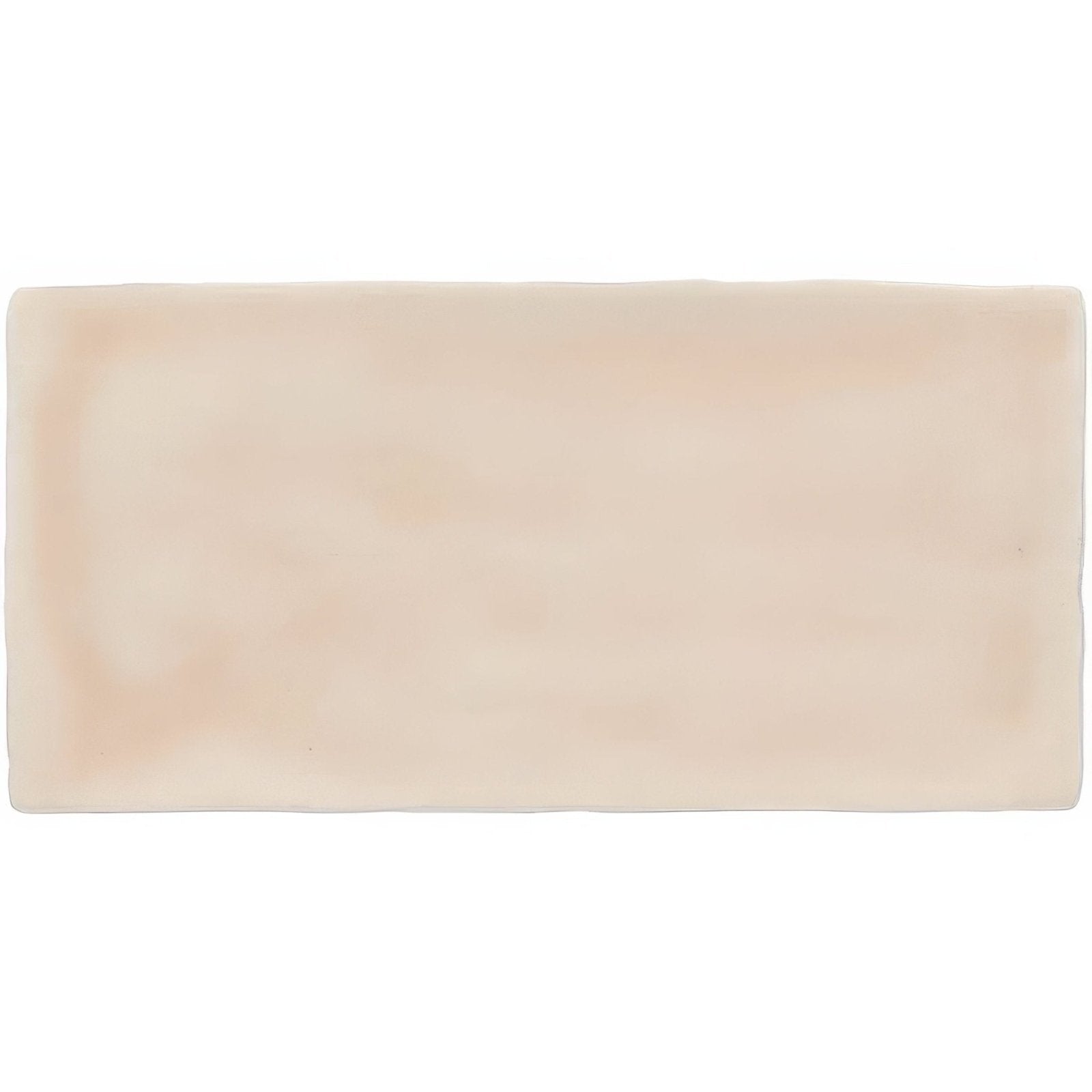 Cream-colored rectangular ceramic Thebes brick tile with smooth slightly glossy finish ideal for wall or floor use