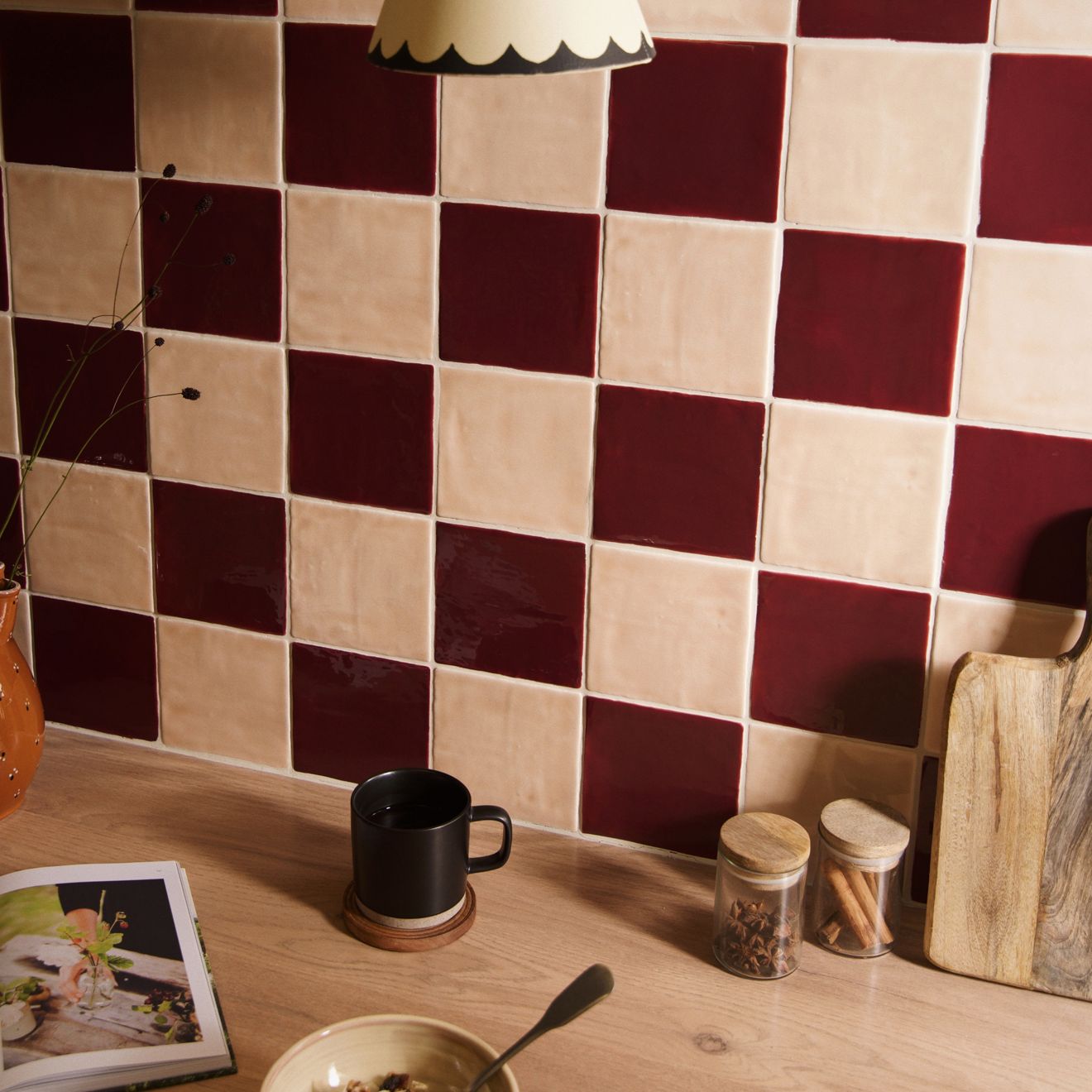 Thebes field tile kitchen backsplash with deep burgundy and creamy beige checkerboard square ceramic tiles
