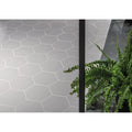 Gray hexagonal matt tiles with white grout lines from the timeless hexagon grey matt collection