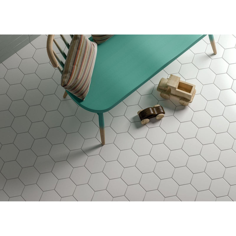 Teal-colored wooden chair with striped woven cushion featuring timeless hexagon white matt finish