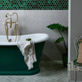 Deep emerald green freestanding bathtub with polished brass faucet and white porcelain rim tisbury porcelain 80 x 80cm