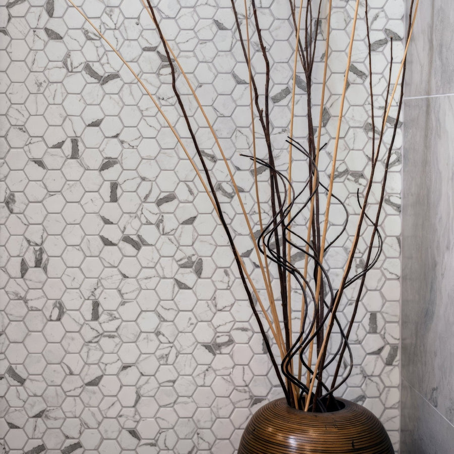 Torcello White Hexagon white hexagonal mosaic with a woven bamboo vase of dried branches