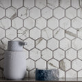 Torcello White Hexagon white hexagonal mosaic with a grey soap dispenser