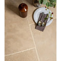 Beige touraine limestone seasoned stone tiles with textured natural finish and visible grout lines