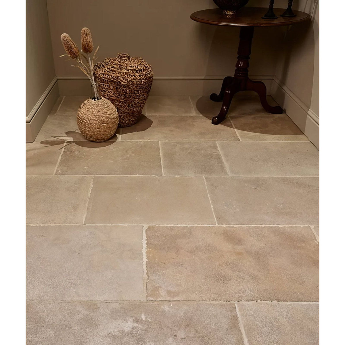 Beige touraine limestone seasoned floor tiles with natural uneven edges and subtle tone variations