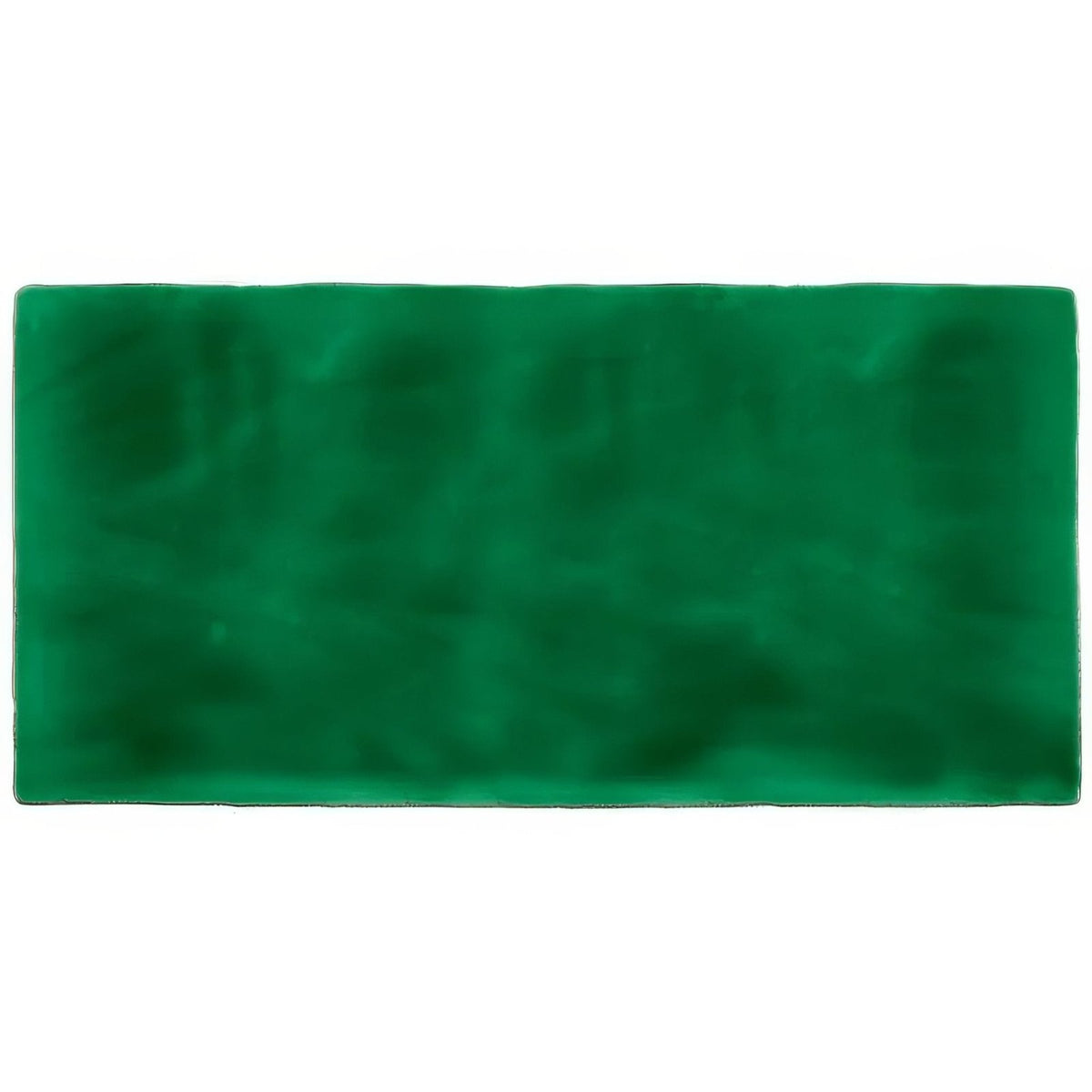 A rectangular deep green velvet tourmaline brick tile mat with soft plush texture and slightly uneven edges