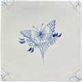 Traditional English Delft butterfly ceramic tile with delicate blue butterfly and flowering stems on creamy white background