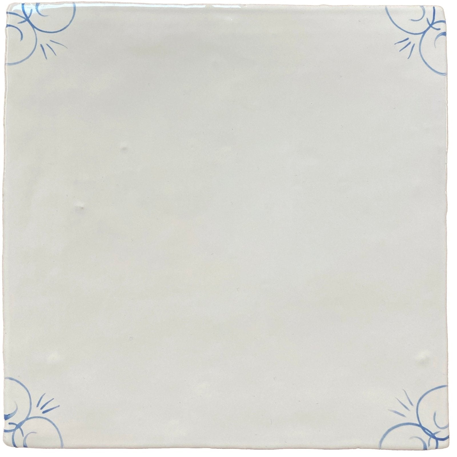 White ceramic tile with delicate blue floral patterns in each corner traditional english delft corner design