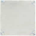 White ceramic tile with delicate blue floral patterns in each corner traditional english delft corner design