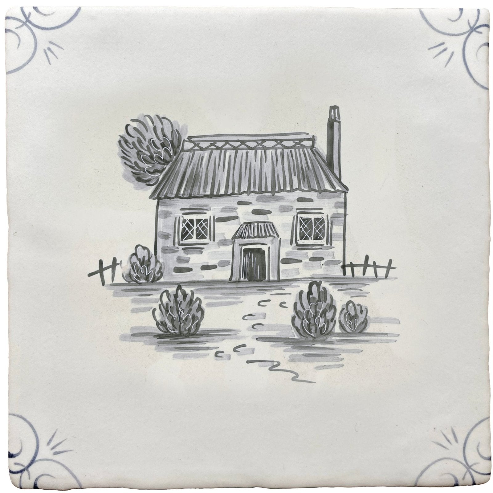 A square ceramic tile with a hand-drawn black ink illustration of a rustic stone cottage in traditional english delft style