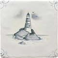 A square ceramic tile with a hand-painted black and white traditional english delft lighthouse illustration