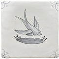 White ceramic tile with hand-painted black and gray swallow in flight above nest and decorative corner swirls traditional english delft
