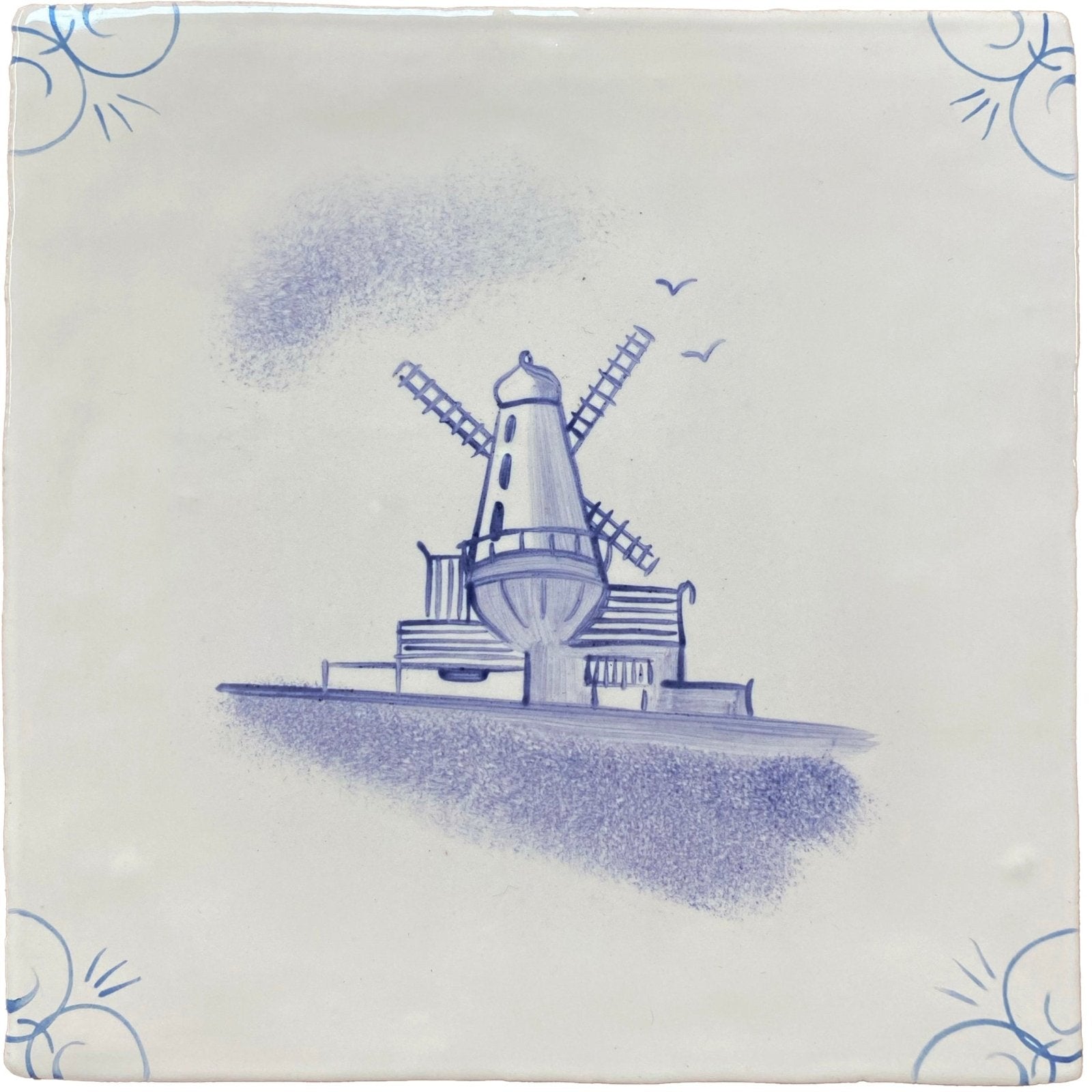 Traditional english delft blue and white ceramic tile featuring a traditional dutch windmill design
