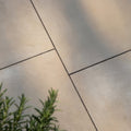 Beige trafalgar sandstone etched paving tiles with textured stone finish and dark grout lines for outdoor use