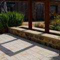 Light beige rectangular trafalgar sandstone tumbled klinkers forming a paved patio area with a tumbled finish