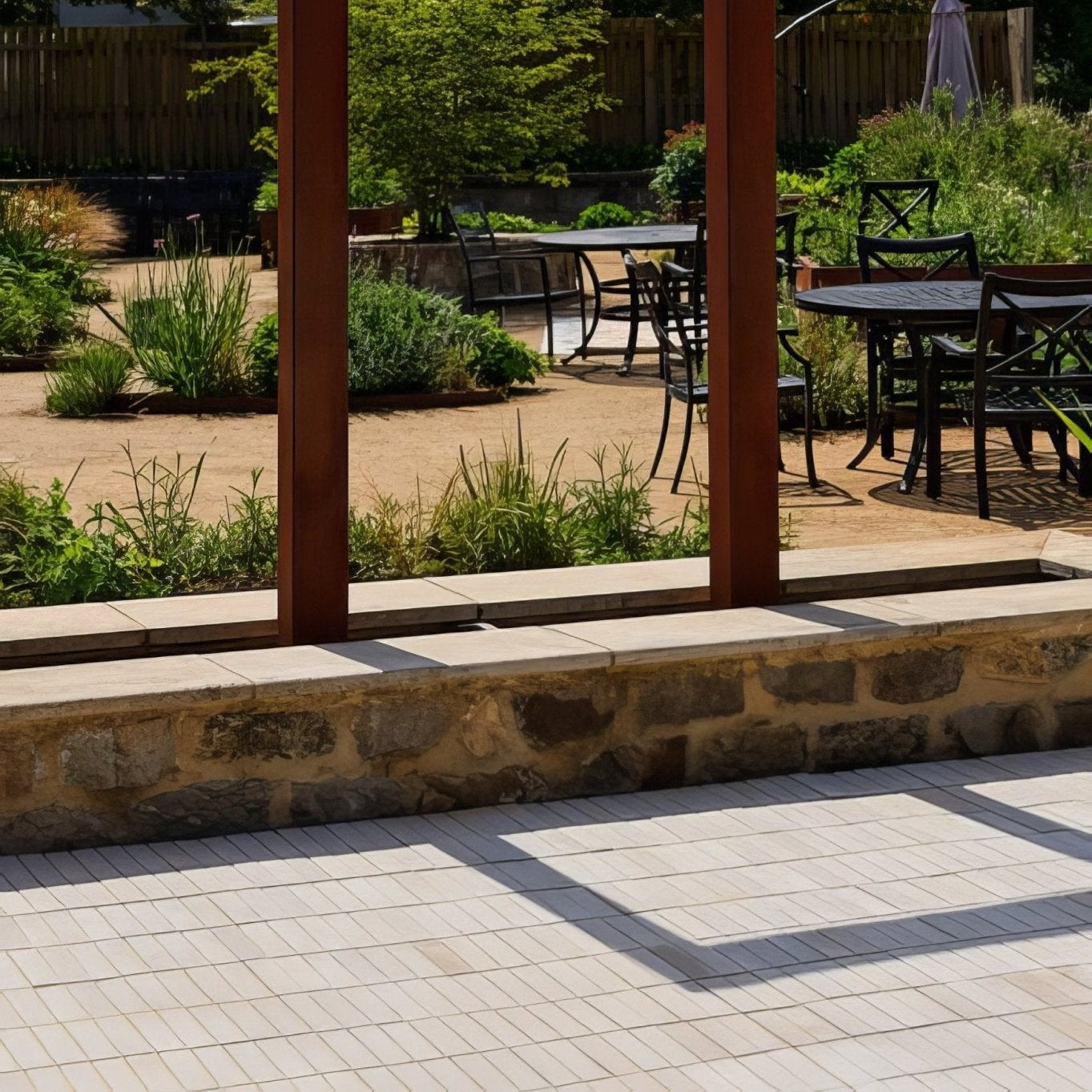Black wrought iron patio furniture set on trafalgar sandstone tumbled klinkers outdoor flooring