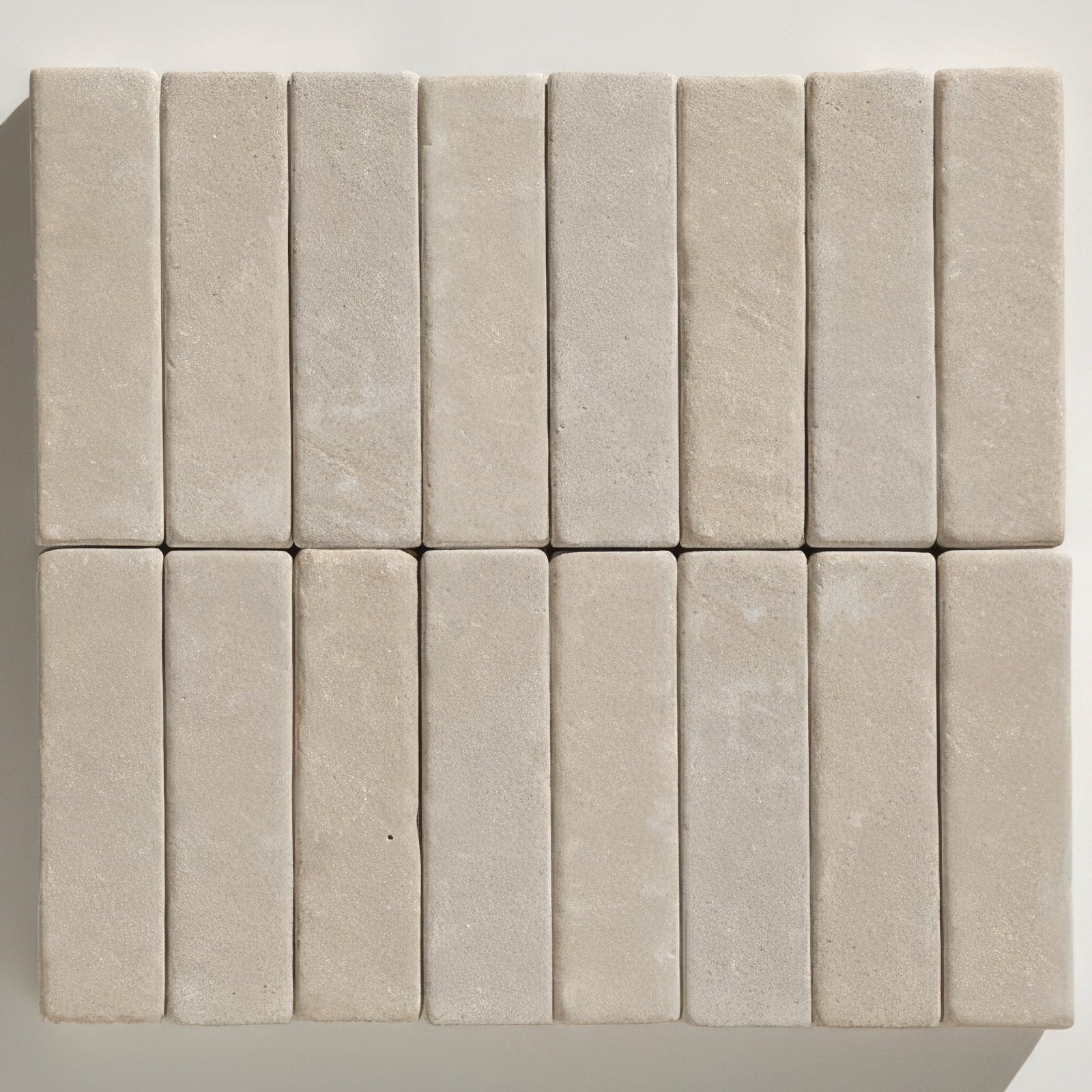 Beige rectangular Trafalgar sandstone tumbled klinkers arranged in a neat grid pattern showing natural texture
