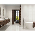 Trevi 1822 White Polished cream marble-effect tiles with a freestanding bathtub