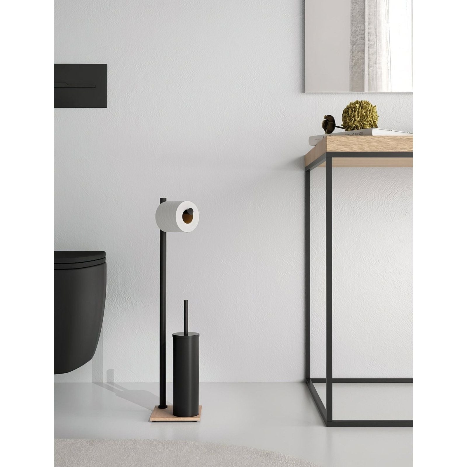 Black metal toilet paper holder with wooden base and black cylindrical brush stand in Trilly bathroom butler black bamboo set