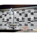 Trip Asi Gris Mosaic black, white and grey glass mosaic with a chrome tap