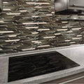 Trip Belart Marron Mosaic dark grey and silver mosaic with a black induction cooktop