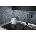 Trip Cloudy Grey Mosaic grey and white marble mosaic with a white electric kettle