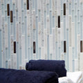 Trip Lluvia Blanco Mosaic light blue and white glass mosaic with a dark blue towel