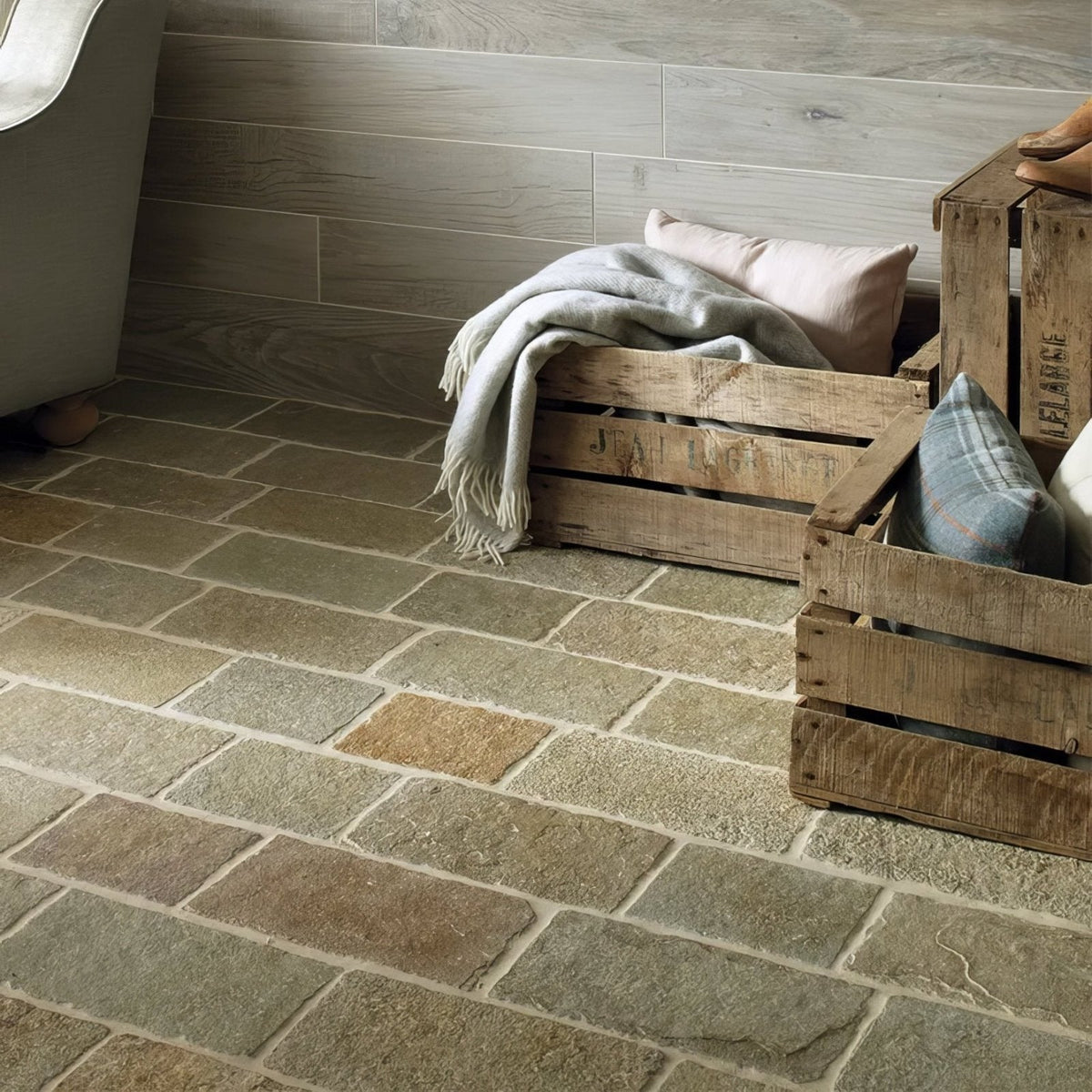 Rustic wooden crates with trusloe limestone cobble seasoned finish filled with soft blankets and pillows