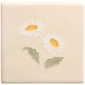 Cream-colored ceramic tile from tubelined floral collection featuring two raised white daisies with yellow centers and green leaves