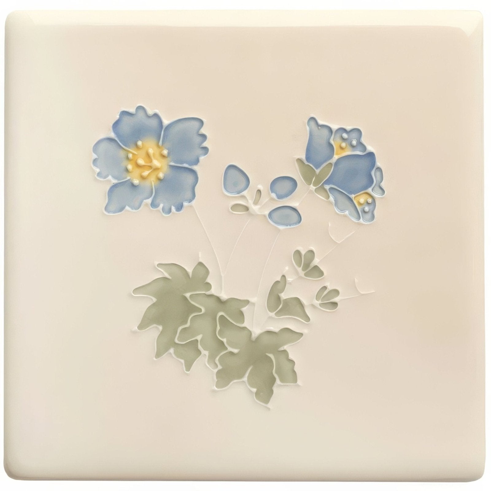 Cream-colored ceramic tile from tubelined floral collection meadow cranesbill with raised blue flowers yellow centers and green leaves