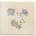 Cream-colored ceramic tile from tubelined floral collection meadow cranesbill with raised blue flowers yellow centers and green leaves