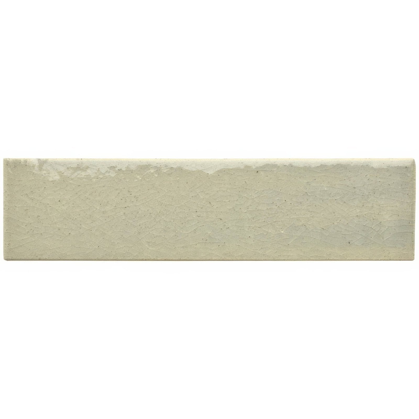A rectangular off-white ceramic tundra brick tile with a textured uneven surface and subtle speckles