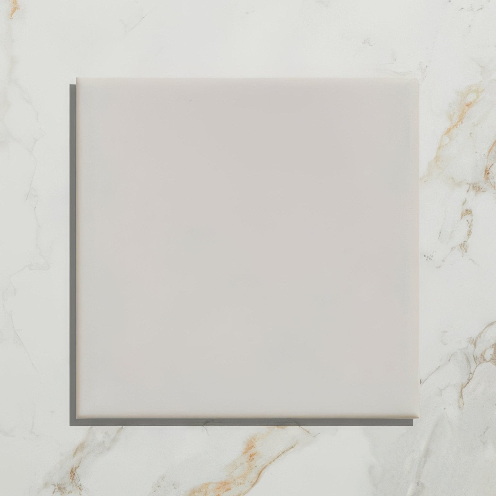 A sleek white ceramic deep white square tile with a smooth matte finish from Tunstall Ceramic