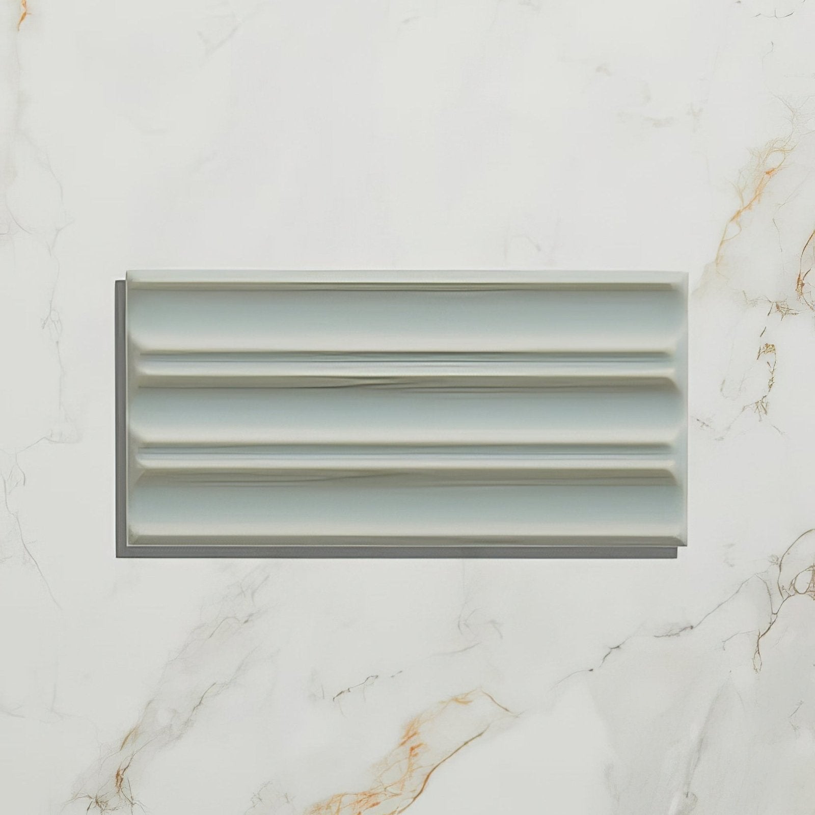 A sleek light gray ceramic fluted brick tile with a modern ribbed design for contemporary wall applications