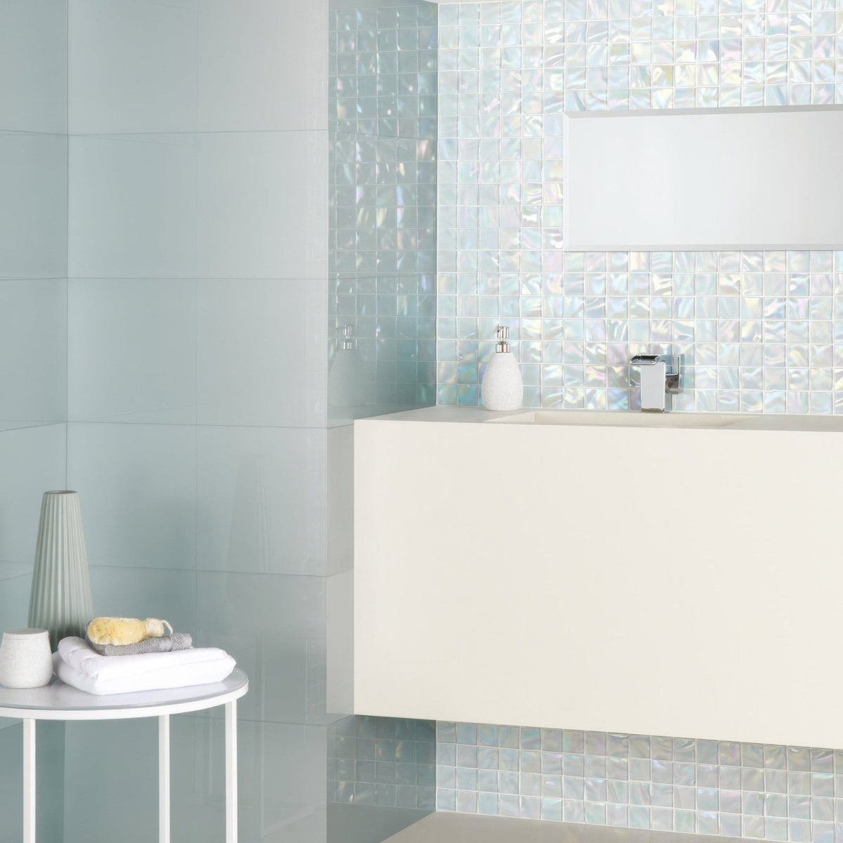 Ultimo Shell Iridescent Mosaic iridescent glass mosaic in a bathroom with a white sink and chrome tap