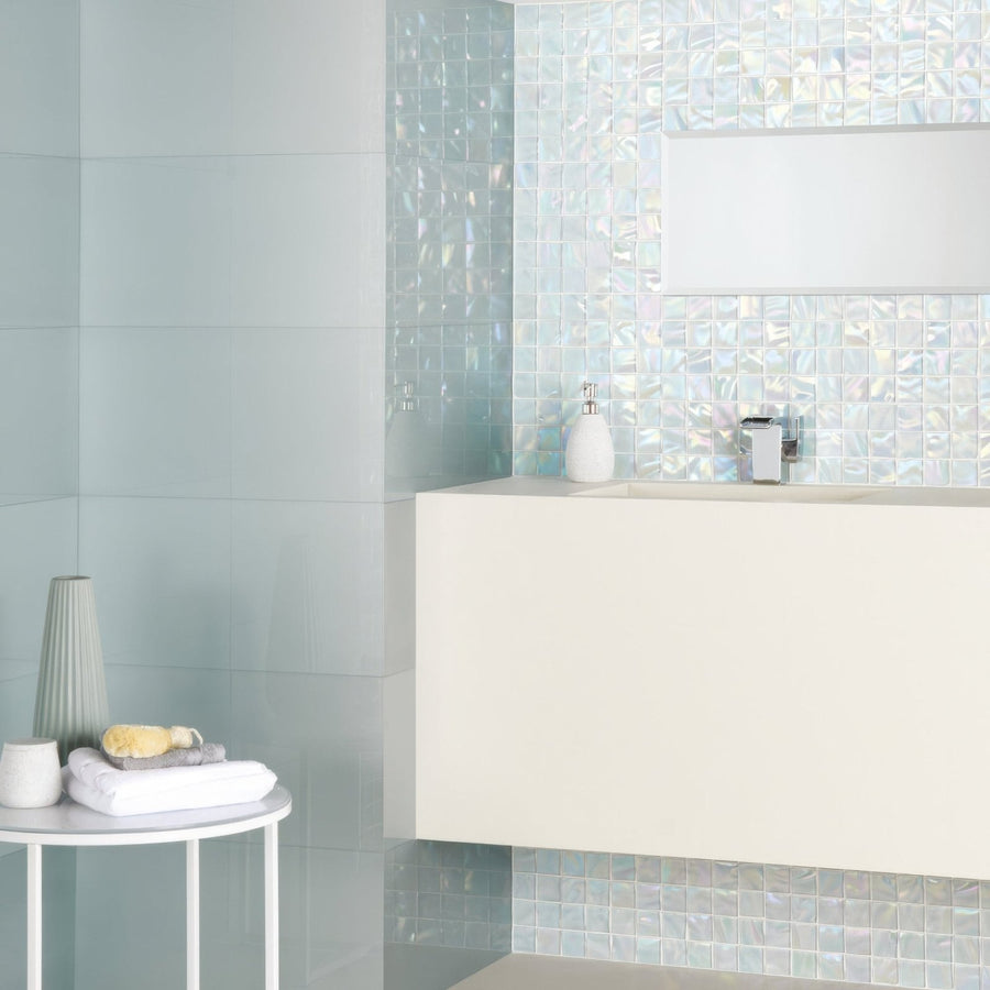 Ultimo Shell Iridescent Mosaic iridescent glass mosaic in a bathroom with a white sink and chrome tap
