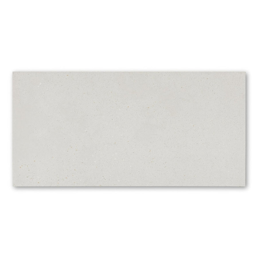 A sleek rectangular umbrian white 30 x 60cm ceramic tile with subtle matte finish and faint gold speckles