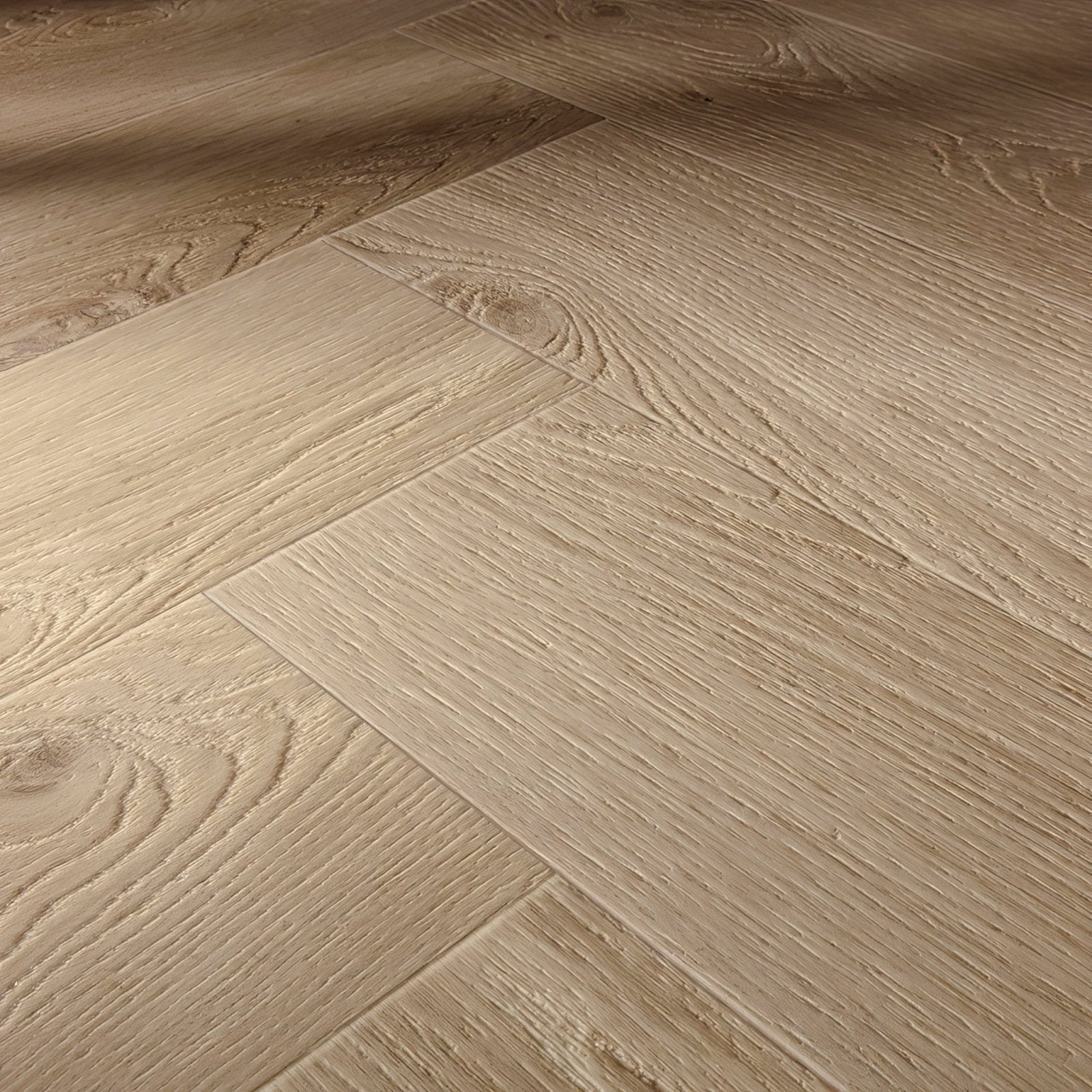 Light beige hardwood flooring with natural wood grain arranged in an unagi f317 herringbone pattern