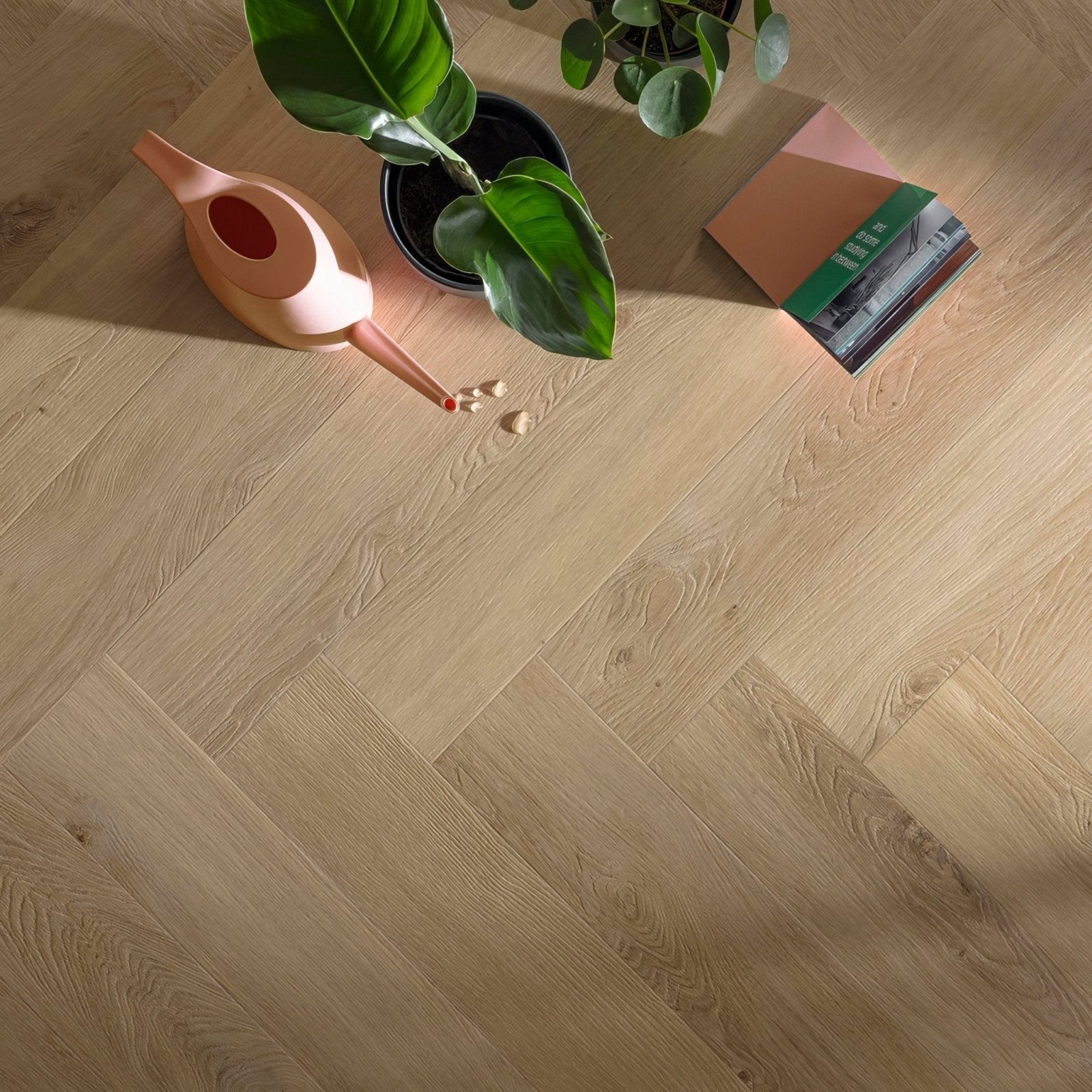 Light oak-colored hardwood floor in a herringbone pattern from unagi F317 herringbone collection