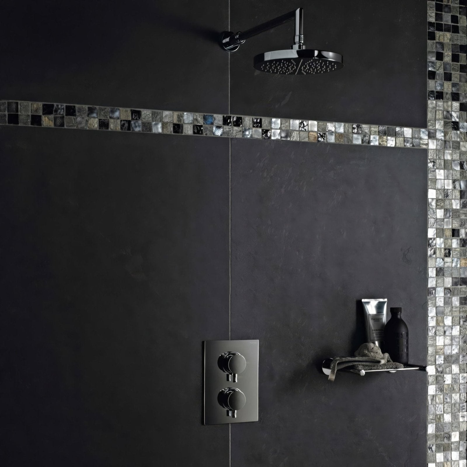 Chrome-finished showerhead with sleek circular design mounted on black tiled wall for urban slate 60 x 40 black grey