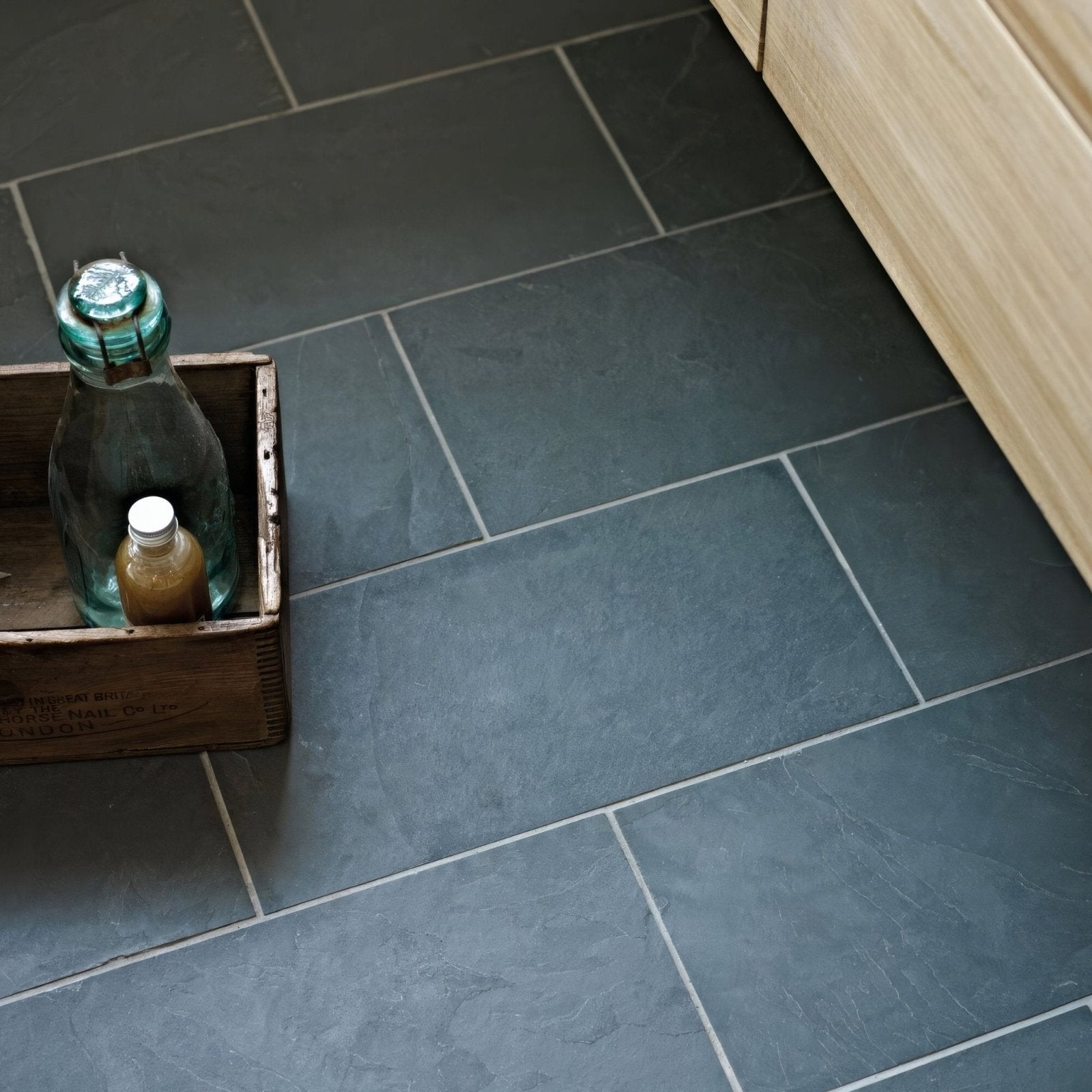 Dark gray urban slate 60 x 40 black grey tiles with subtle veining and matte finish in staggered pattern