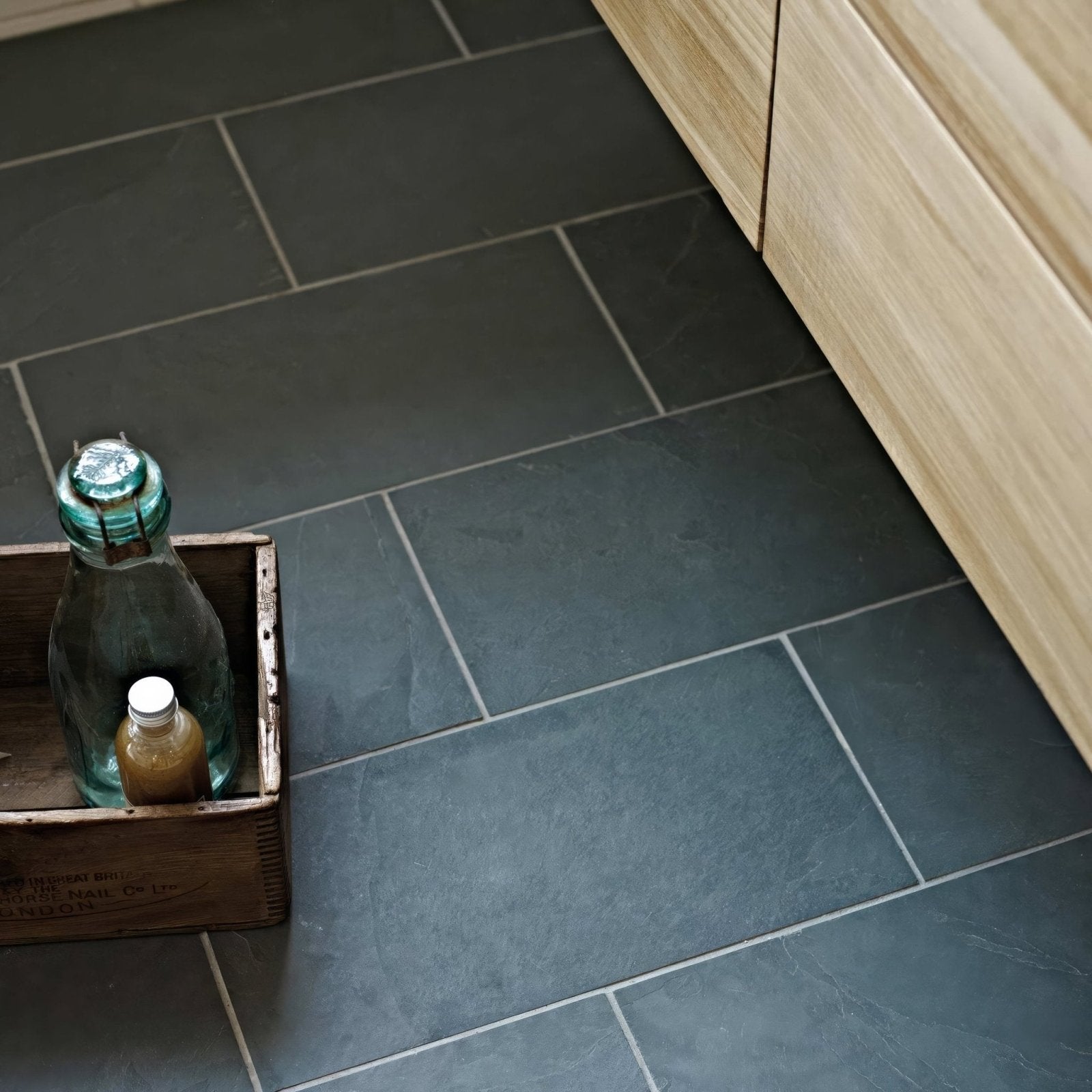 Dark gray urban slate floor tiles with subtle natural veining and light gray grout lines 60 x 40 grey green