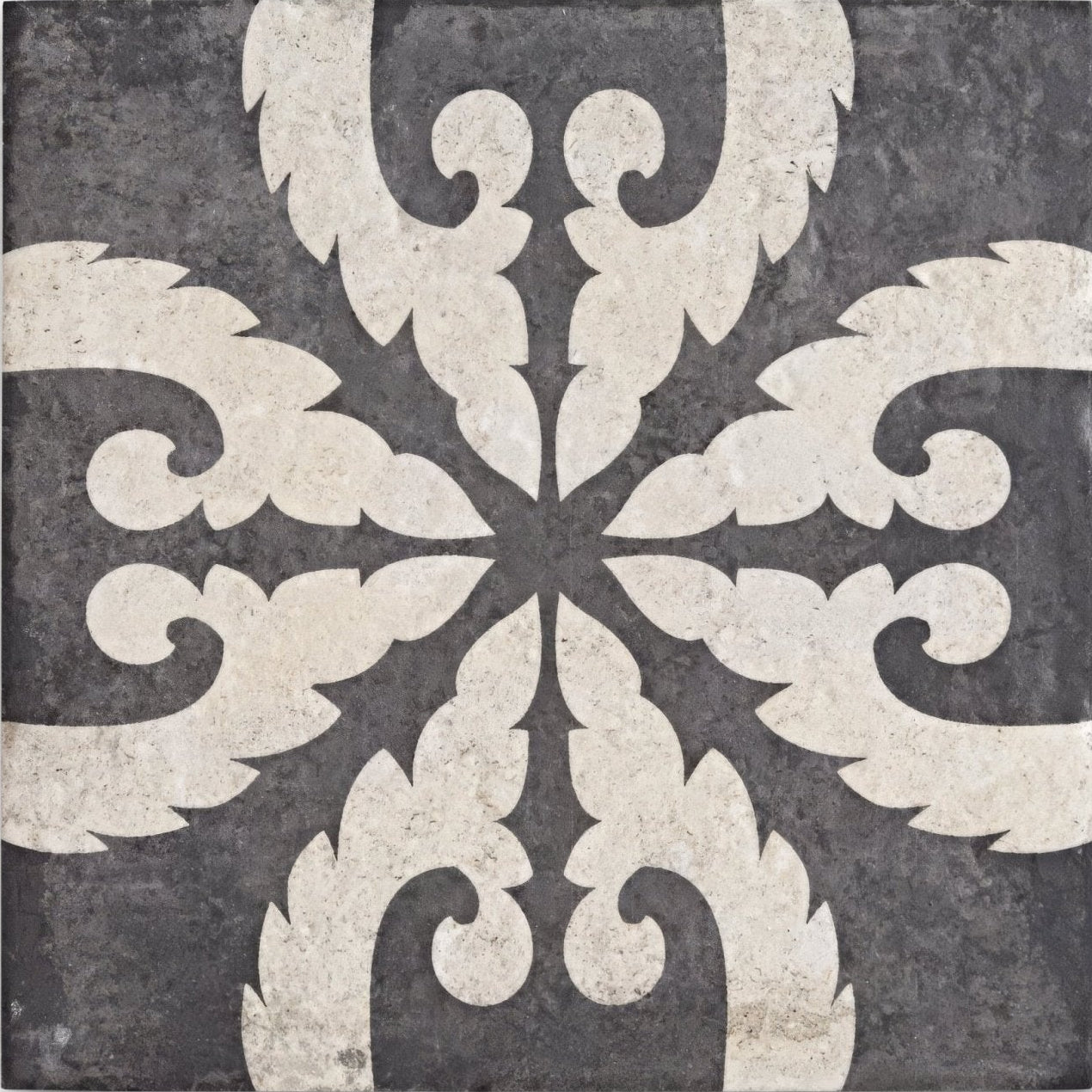 Urban velasco patterned porcelain tile featuring dark gray stone with symmetrical cream ornamental swirl leaf motifs