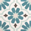 Vacation porcelain cordoba tile features blue and white geometric starburst pattern with dark brown fleur-de-lis accents